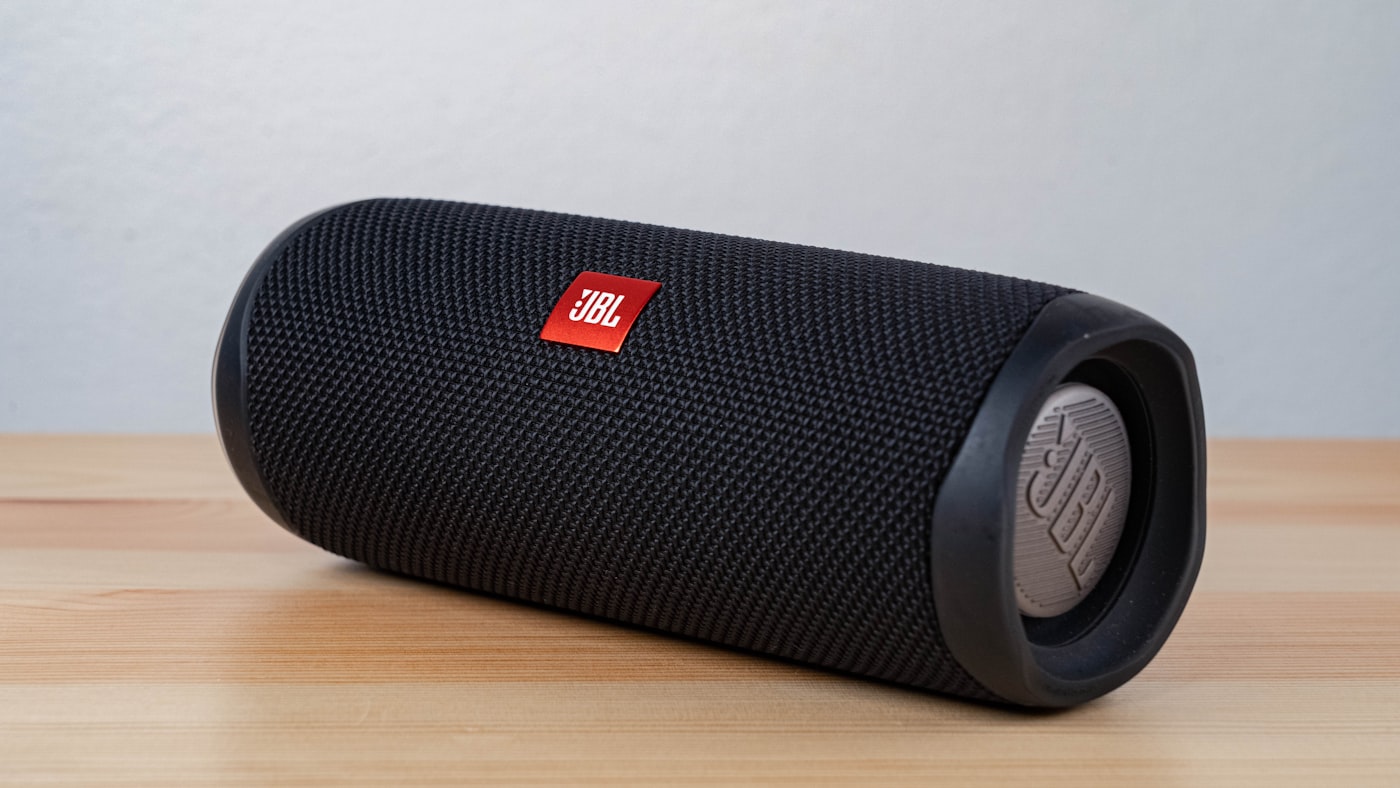 Bluetooth speaker on a balcony table during an evening gathering