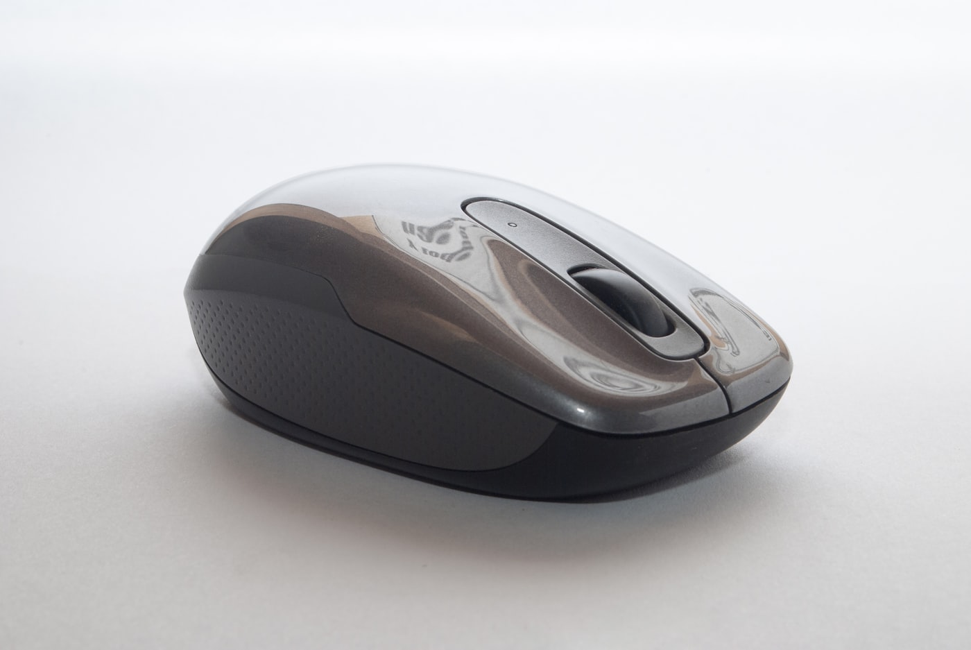 Gaming mouse on a desk mat beside a keyboard