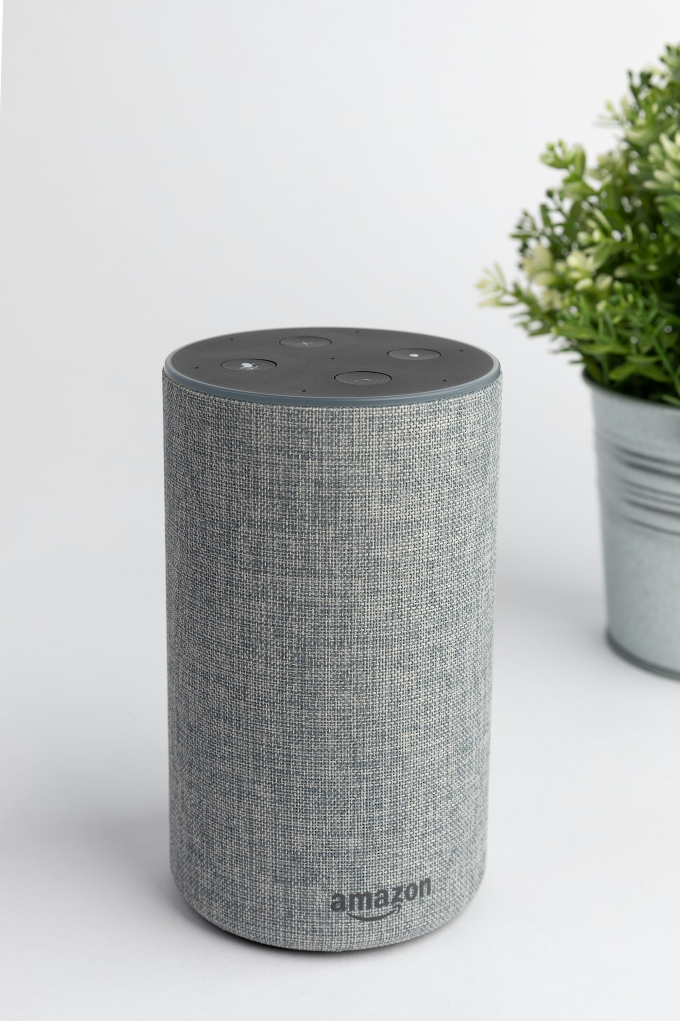 Smart speaker on a kitchen counter during morning coffee prep